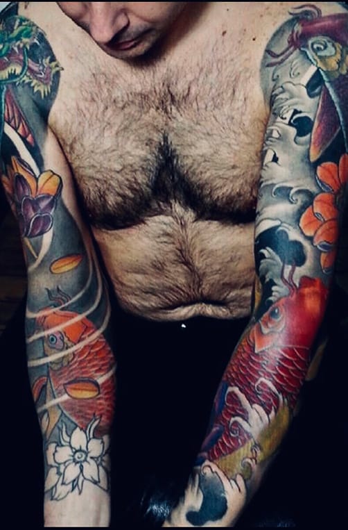 man with tattoo sleeves
